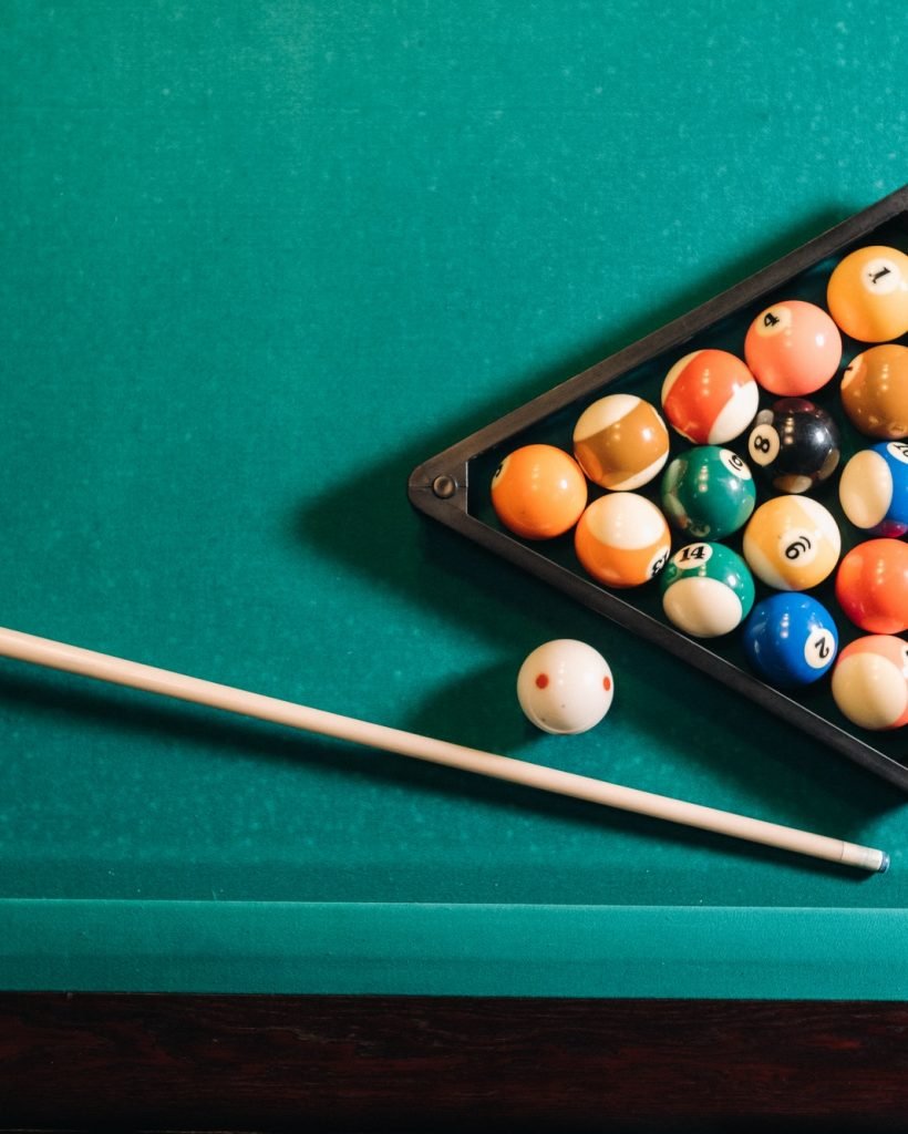 billiard-table-with-green-surface-and-balls-in-the-billiard-club-pool-game-3.jpg
